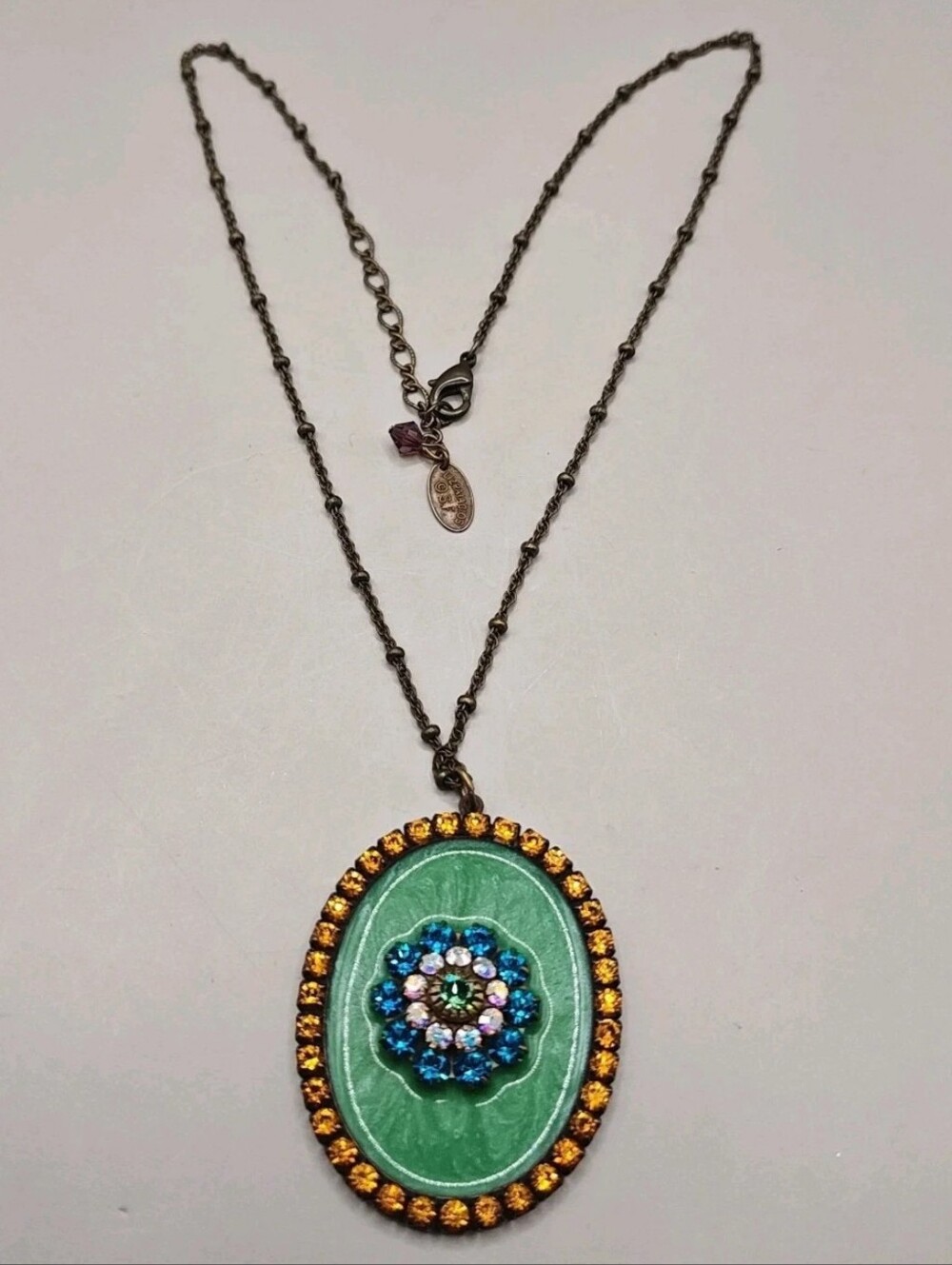 Liz Paiaicos Victorian Revival Blue Rhinestone Medallion Copper Pendant Necklace